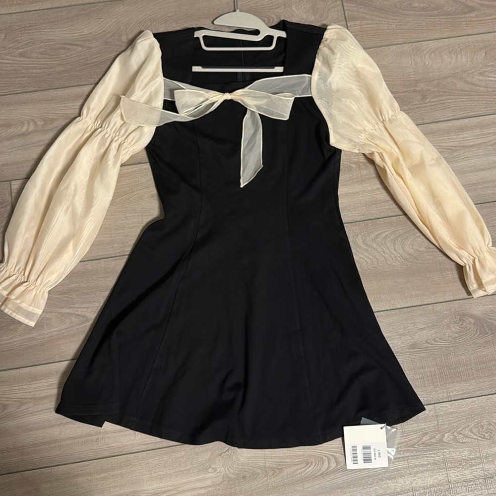 Medium size black Ivory dress. Brand new!!!
